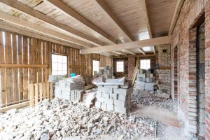 interior renovation progress with exposed wooden beams pile rubble floor old house 1 interior-renovation-progress-with-exposed-wooden-beams-pile-rubble-floor-old-house (1)